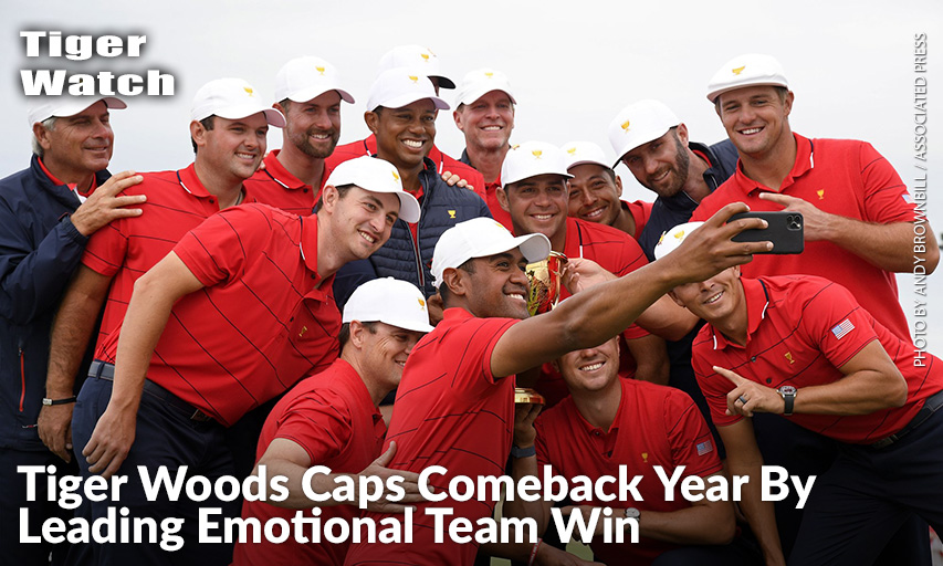 U.S. Team Player Tony Finau Uses A Phone To Photograph Teammates And The Trophy.