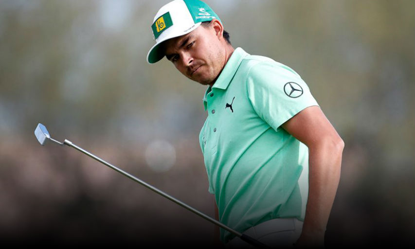 Rickie Fowler watches his birdie putt go wide on the second green during the first round of the Phoenix Open. (Matt York/AP)