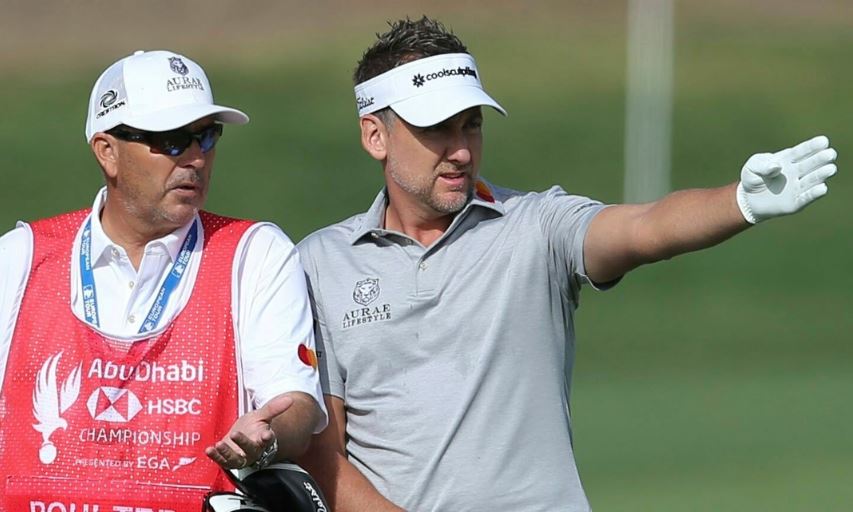 Ian Poulter of England talks to his caddie on the 10th hole in round three of the Abu Dhabi Championship. (AP Photo/Kamran Jebreili) Ian Poulter