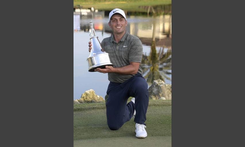 Francesco Molinari poses with the championship trophy after winning the Arnold Palmer Invitational. (AP Photo/Phelan M. Ebenhack) Francesco Molinari