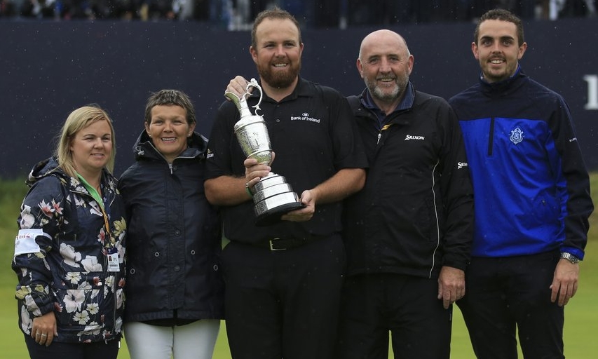 Ireland's Shane Lowry holding the Claret Jug trophy poses with his family on the 18th green after winning the British Open. (AP Photo/Jon Super) Shane Lowry