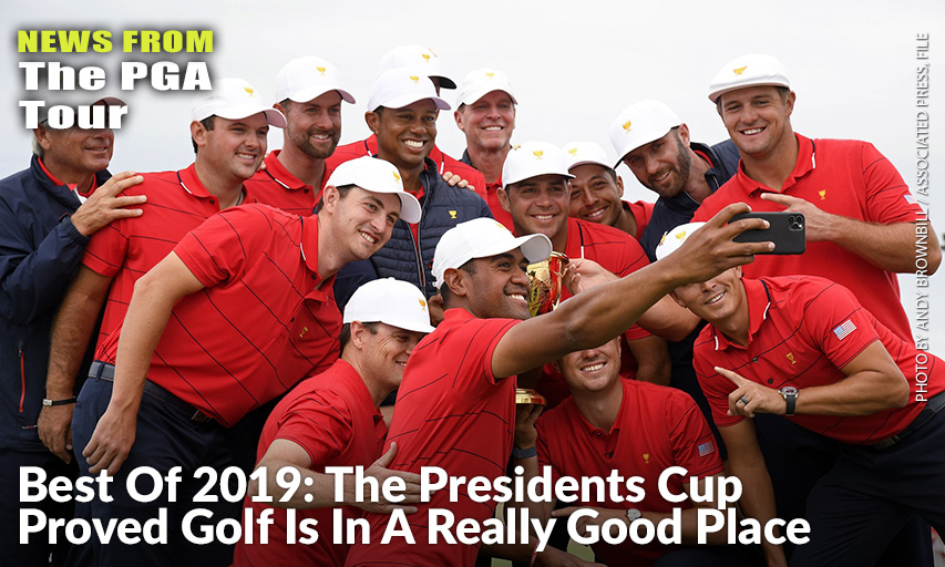 U.S. Team Player Tony Finau Uses A Phone To Photograph Teammates And The Trophy After Winning The 2019 Presidents Cup.