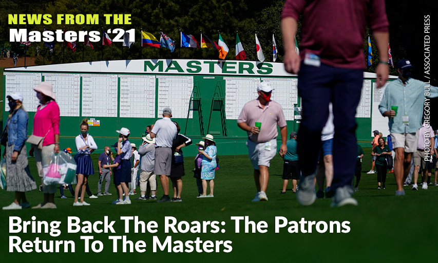 Patrons Walk By The Main Scoreboard During A Practice Day For The 2021 Masters.